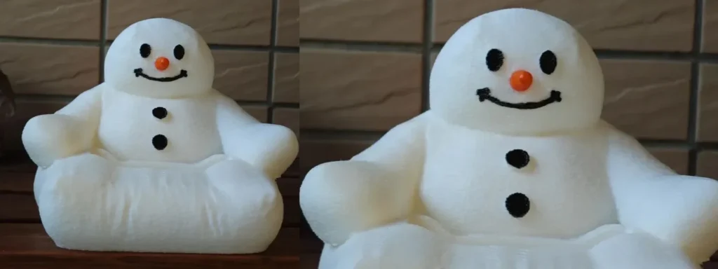 Top 10 božićnih darova koje možete 3D printati 2 3D-ispisani stalak za mobitel u obliku snjegovića na kauču